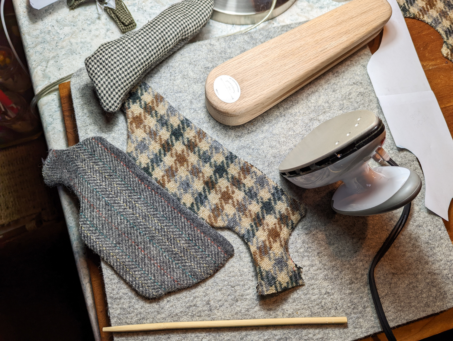 Edgar's tiny vest being steam-pressed